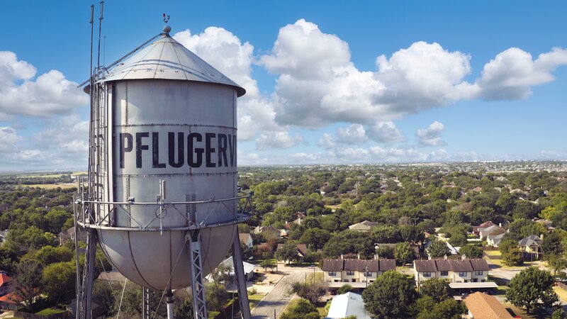 Iconic Pflugerville water tower landmark overlooking residential neighborhoods in Pflugerville, Texas